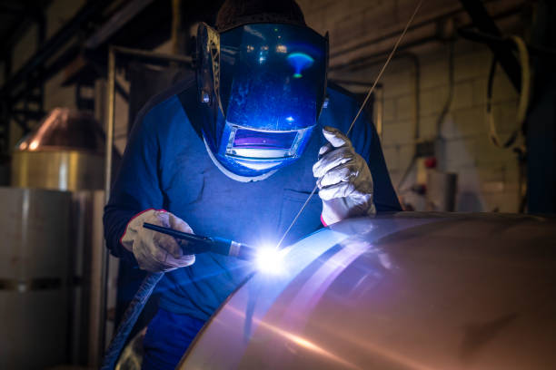 Welder welding stainless steel tank at industry workshop 304L-stainless-steel-coils-1-2