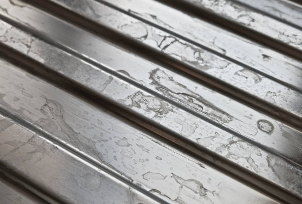 Hard water deposits. Calcifications on a kitchen sink SUS-plate