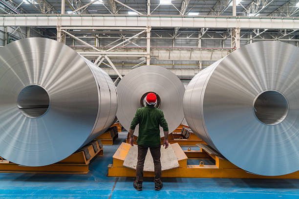 stainless-steel-coils, Worker standing in the factory